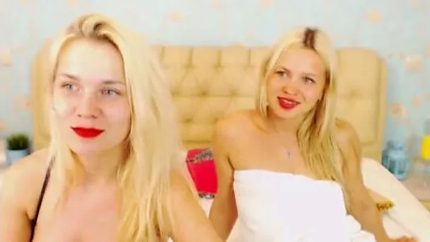 Blonde lesbians preparing for some amateur striptease
