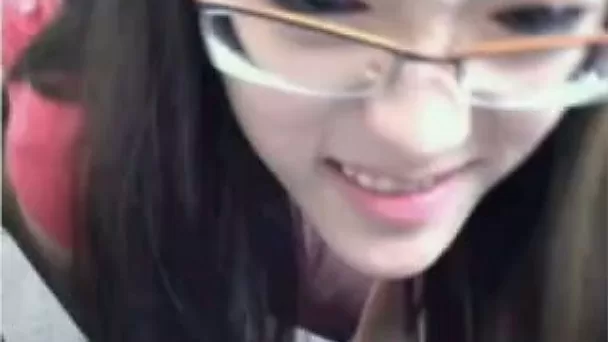Slender kinky black head from Asia flashed her small tits on webcam