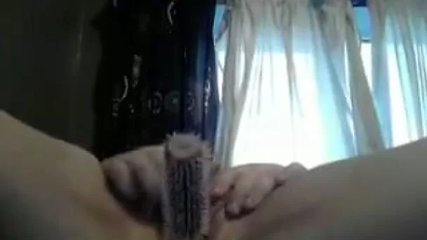 Chunky white redhead girl in her bedroom masturbating with a hairbrush