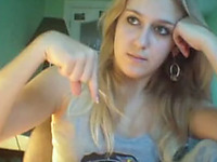 Cute blonde college girl is bored on webcam in her dorm room