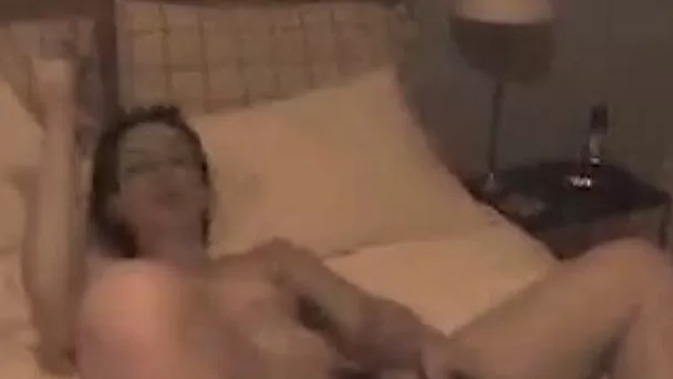 My sexy brunette wife stuffs her juicy muff with a dildo