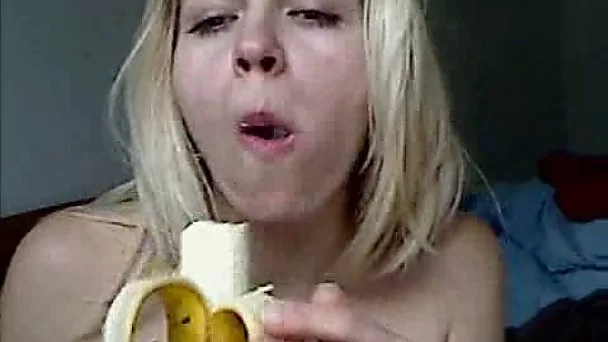 Hot blonde webcam chick temptingly eat banana topless