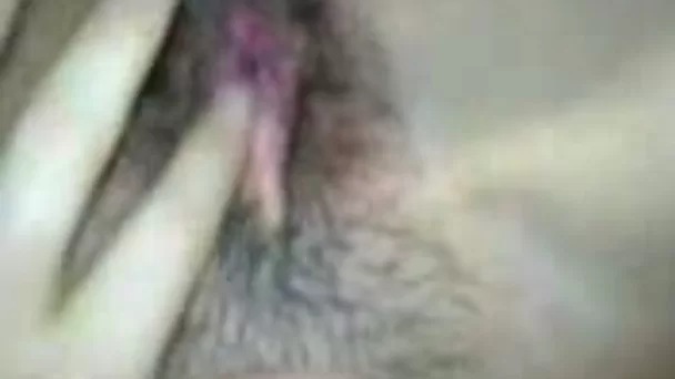 Sultry black haired GF fucks her wet hairy pussy with dildo