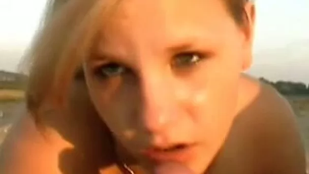 Blond haired girl is fucked right on the beach one sunny summer day