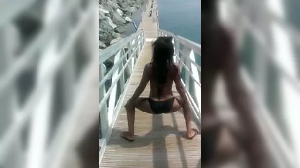 Dissolute black bitch with sexy body shakes her great ass in bikini