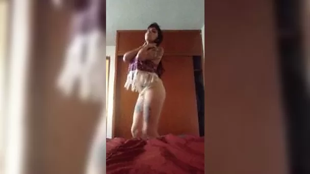 Tattooed hooker stripping and dancing on camera