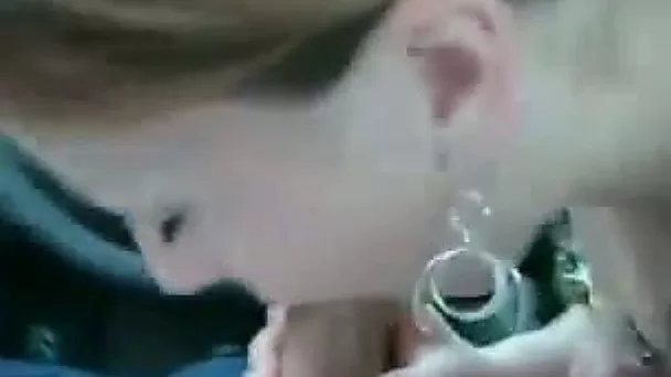 Redhead girl bends over in the car and takes my dick in her mouth