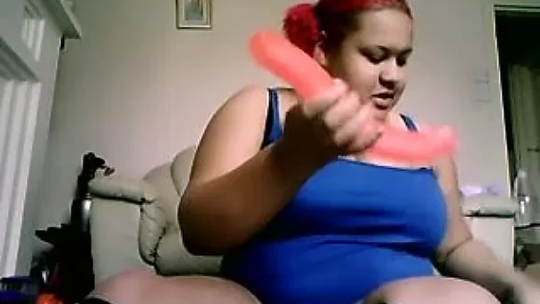 BBW girl with red hair poking her snatch with dildo