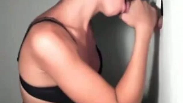 Beautiful and sexy girl sucking my dick through a gloryhole
