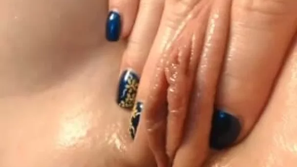 Awesome closeup of sweet babe tickling her juicy pussy in tender way