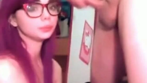 Pink haired nerdy sexy cam gal was totally into sucking a tasty dick