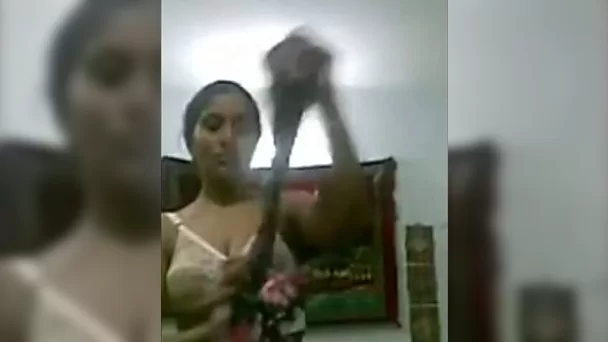 Busty Indian brunette fucks herself with a glass bottle