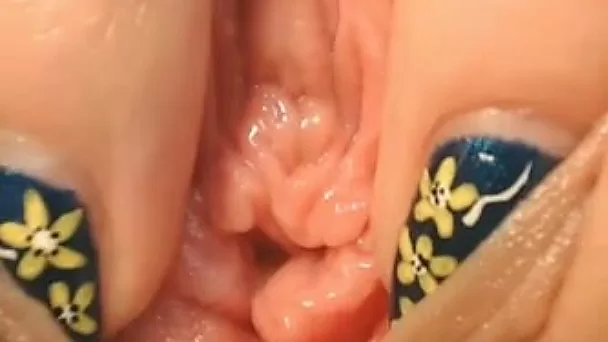 Cute blonde chick showing pinkish pussy closeup