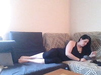 Lustful brunette flatmate masturbating on a couch
