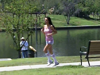 Cute and sporty brunette sweetie jogging in the park