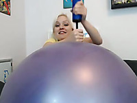 Hilarious blonde nympho with big boobies was playing with inflatable toy