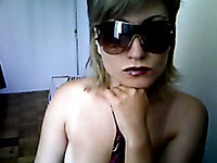 Amateur chick in shades showing shaved punani on camera