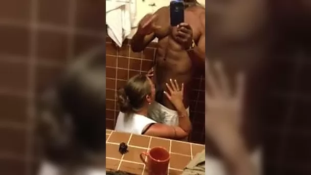 Kinky white bitch sucking big black dick in the bathroom