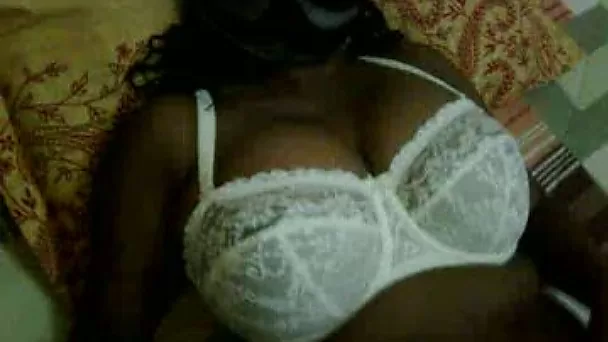 Playing with brownskinned mom's big boobs in amateur video