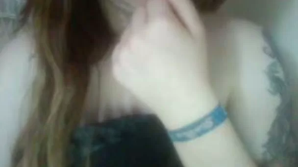 Red haired teen playing with her titties sensually