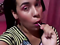 Kinky teen gal sucking lollipop while playing with her punani