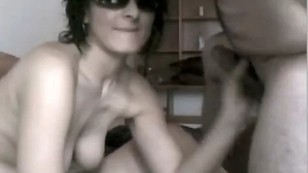 Kinky MILF in glasses sucks her boy's dick on webcam chat roulette