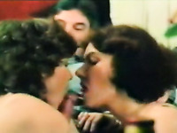 Chubby dude with mustache getting double blowjob from brunettes