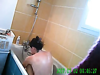 All nude dark haired MILF with big boobies was washing her hair in bathroom