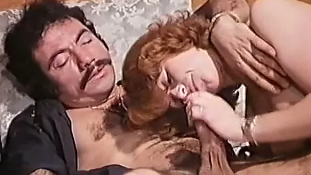 Cute redhead classic lady on the bed eating nice big cock