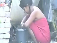Voluptuous woman has her ass filmed by a hidden cam