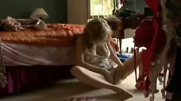 Big boobed chick masturbating with sex toy on a floor at home