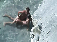 Horny couple fucking passionately on a nudist beach