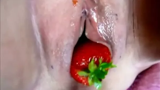 Hussy granny rubbing wet pussy with strawberry in solo masturbation video