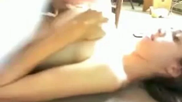 Rubbing my dick between my girl's big titties in homemade video