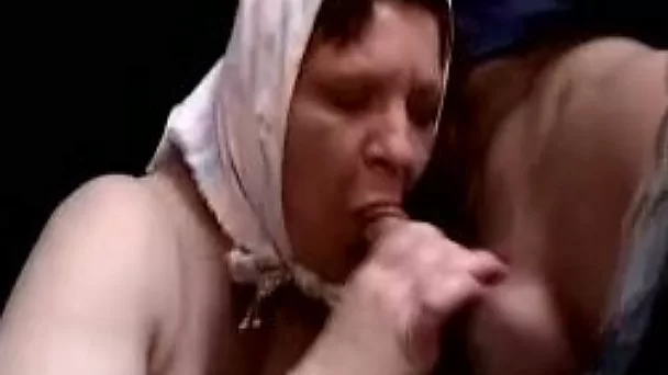 Old ugly woman with big saggy boobs blows dick of a guy at the bar