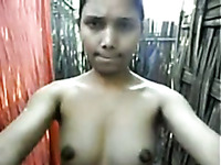Indian village girl showing her titties in the outdoor bathroom