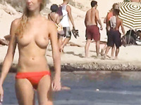 Spying on sexy topless babes on a nudist beach
