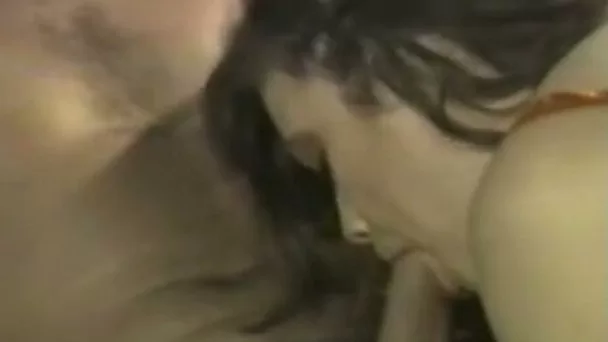 Magnificent and hot brunette busty babe blowing cock on the couch