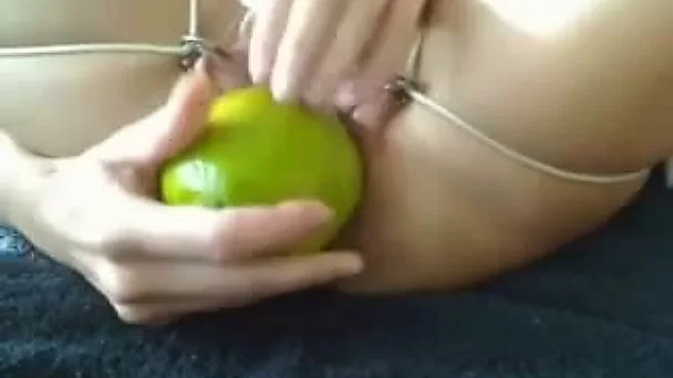 Lusty pale leggy bitch in black stockings was using some candles to stretch cunt