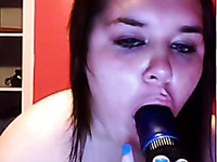 Chubby brunette girl sucking big dildo in amateur webcam video