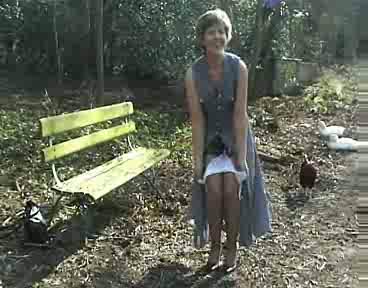 Shameless mature babe exposes her curvy body in the public park