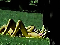 Nasty couple having a sexy time in the public park on the lawn