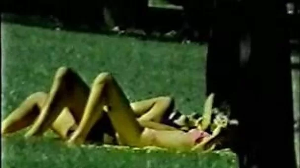 Nasty couple having a sexy time in the public park on the lawn