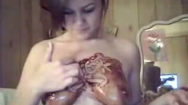 Teeny webcam babe smears her boobs with Hershey's syrup