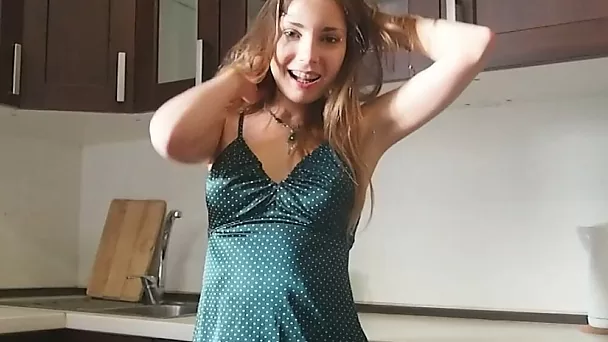 Beauty in a green skirt teases with curves