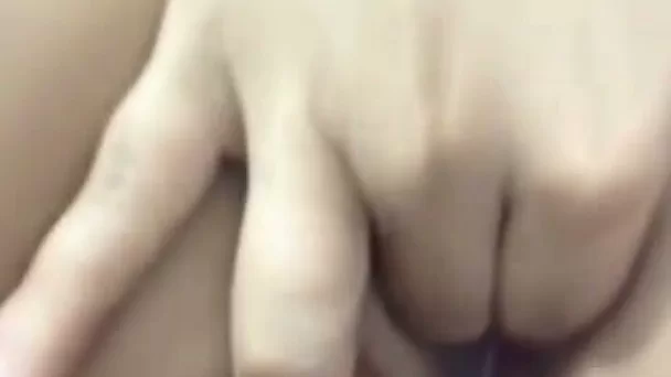 Sweet and slim dark haired girl got busy with fingering her sweet pussy