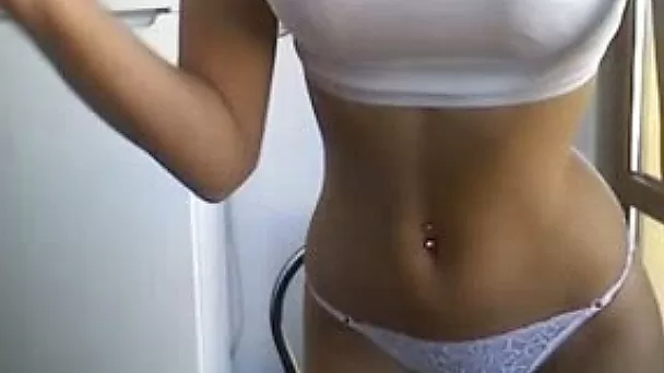Blond haired pretty cam girl in white top showed off her natural tits