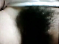 Lusty serious looking webcam black head exposed her rather hairy pussy