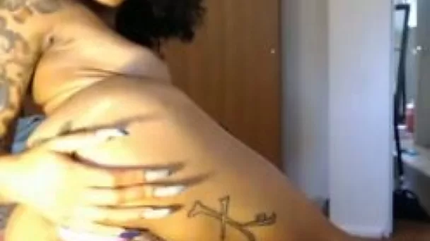 Tattooed curly hottie with slender body was bragging of her juicy bum