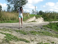 Gorgeous skinny brunette teen in sexy shorts pisses by the road